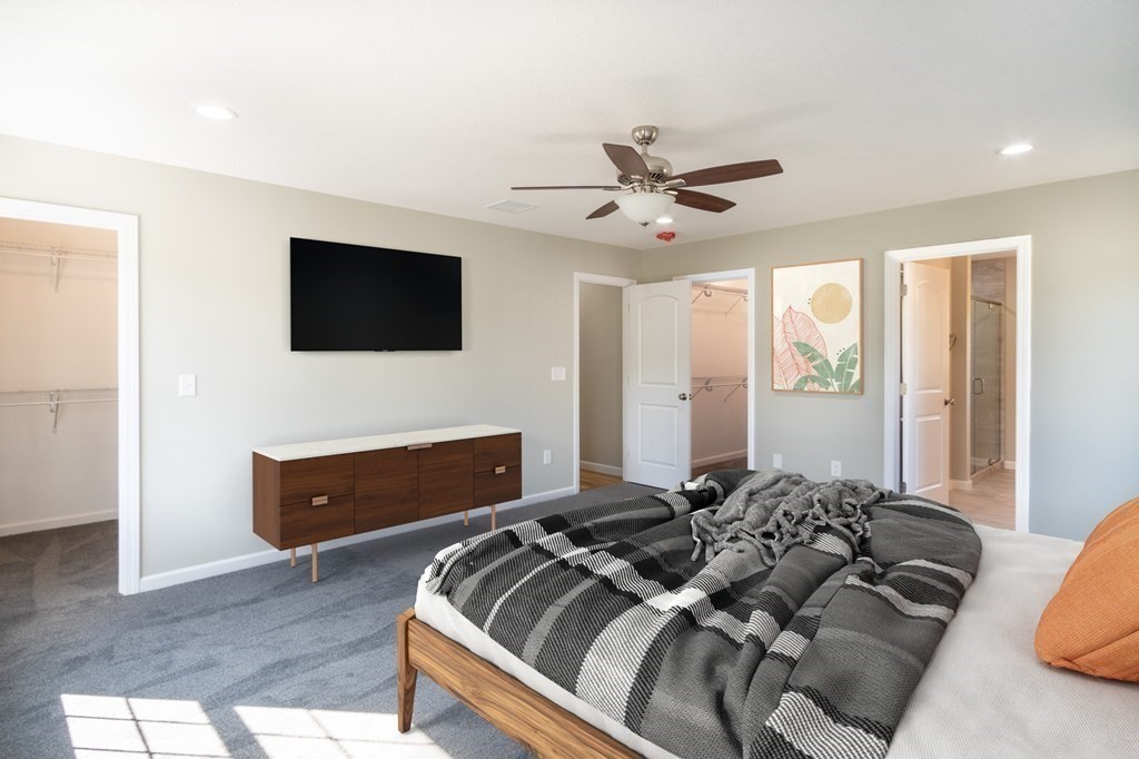 12 Upper Palmer Road Monson, MA 01057 - Photo 15 of 39 a bedroom with a bed and a flat screen tv