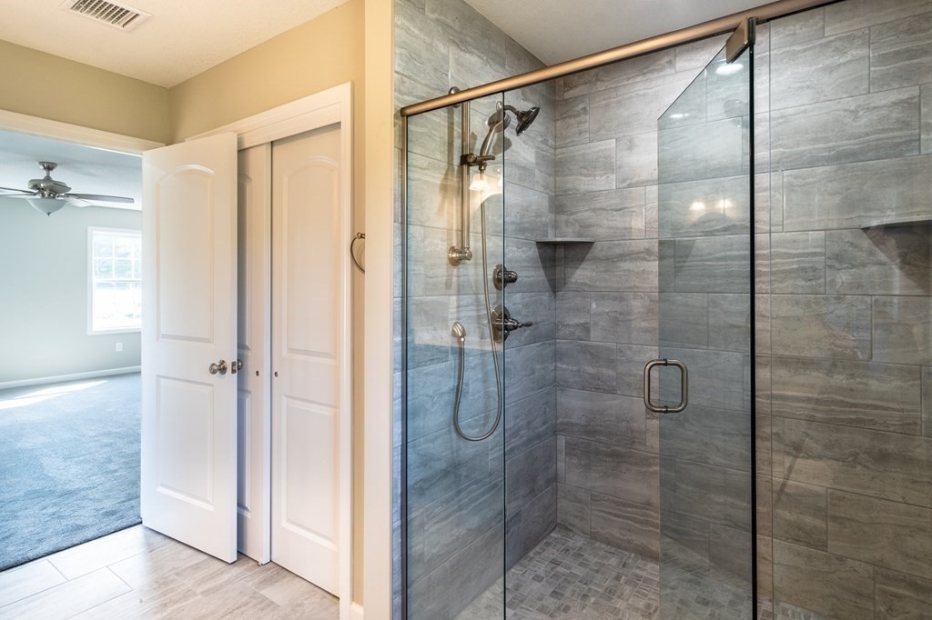 12 Upper Palmer Road Monson, MA 01057 - Photo 19 of 39 a bathroom with a shower and a glass door