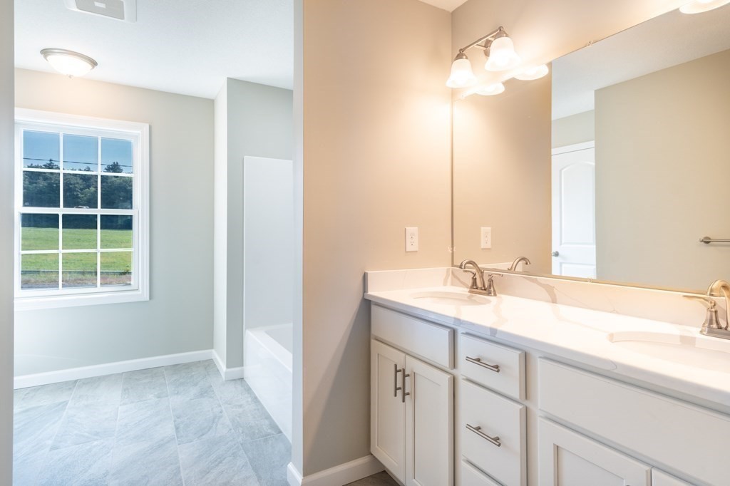 12 Upper Palmer Road Monson, MA 01057 - Photo 22 of 39 a bathroom with a sink vanity granite and a mirror