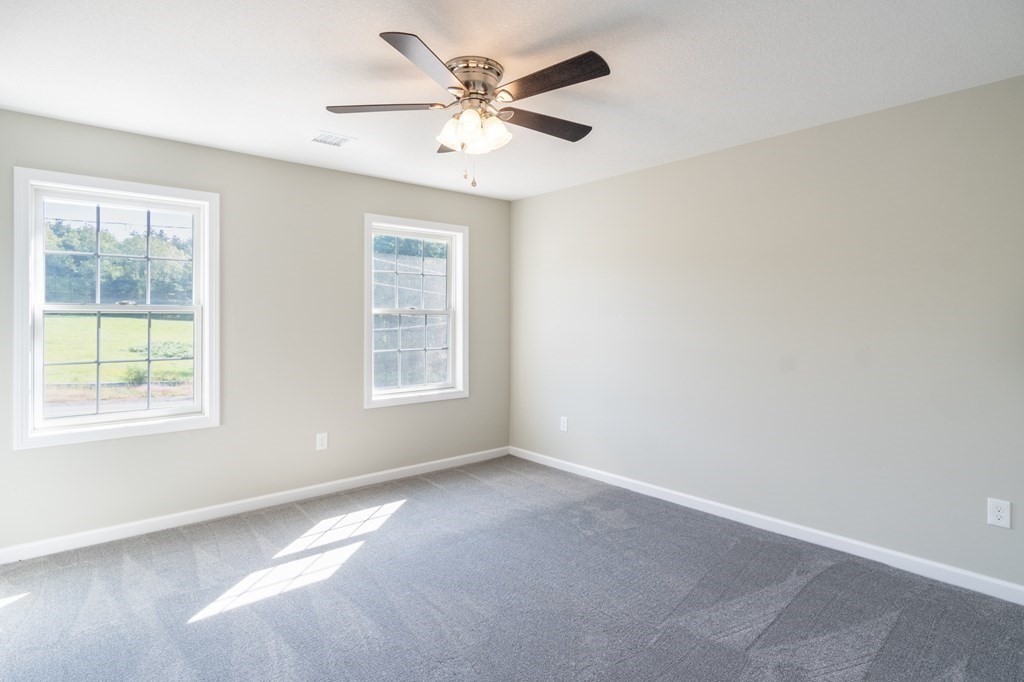 12 Upper Palmer Road Monson, MA 01057 - Photo 26 of 39 an empty room with a window and a fan