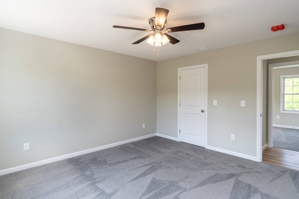 12 Upper Palmer Road Monson, MA 01057 - Photo 27 of 39 an empty room with closet and a ceiling fan