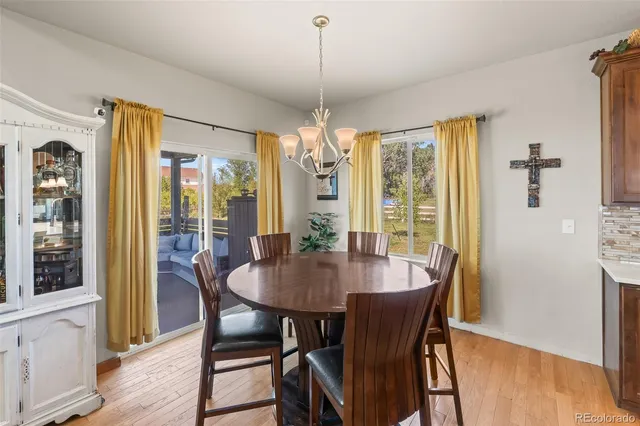 a dining room with furniture window wooden floor