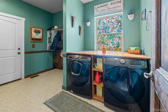 a utility room with dryer and washer