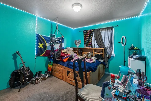 a bedroom with double bunk beds and a window