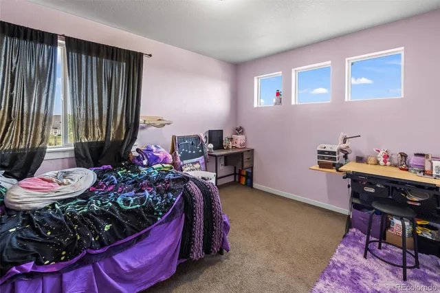 a bed room with a bed and a window