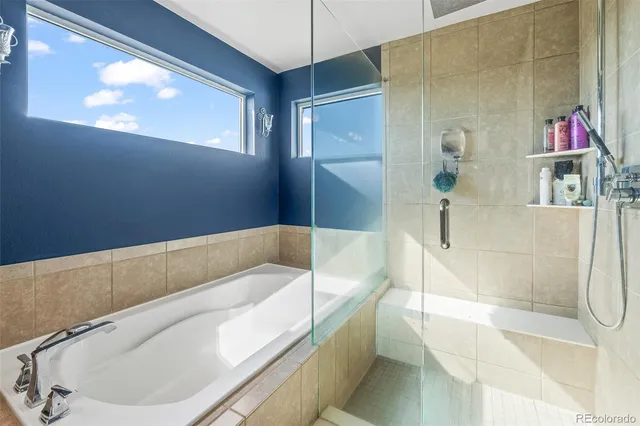 a en suite bathroom with a tub and shower