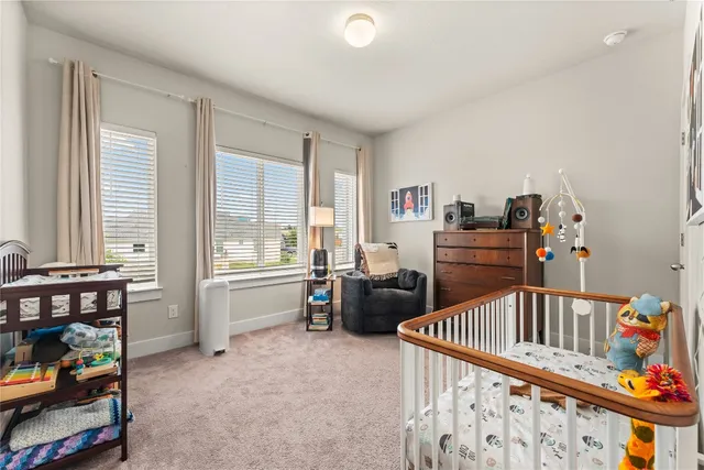 a bedroom with furniture and a window