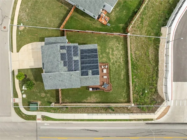a view of a swimming pool with outdoor seating and yard