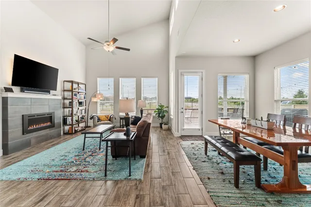 a living room with furniture fireplace and flat screen tv