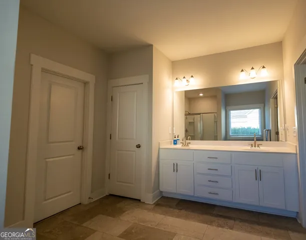 a bathroom with a bathtub and a shower
