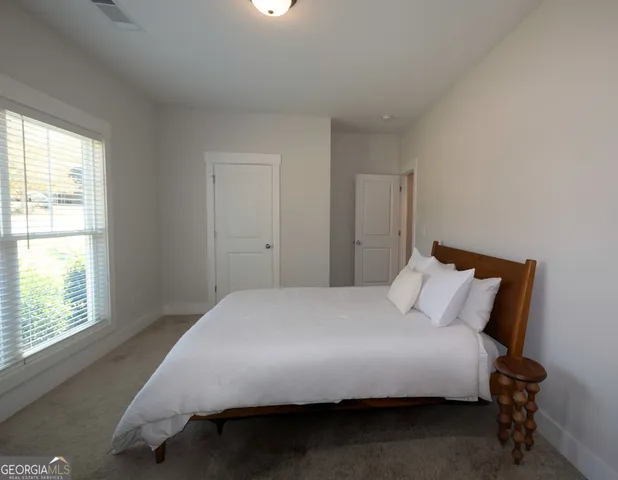 an empty room with a empty space and windows