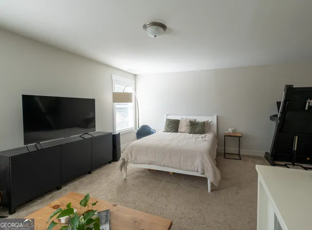 a bathroom with a double vanity sink mirror and toilet