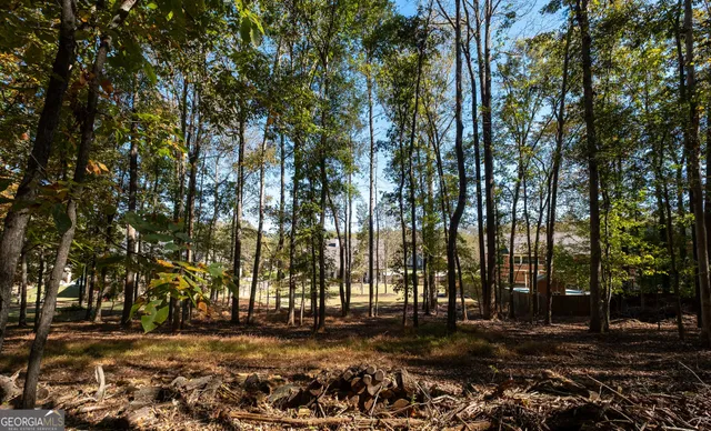 a swimming pool with outdoor seating and yard