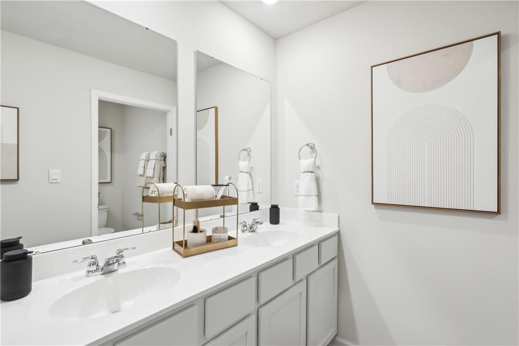 3402 Maple Crest Court Butler, PA 16001 - Photo 15 of 48 a bathroom with 2 sink and a mirror