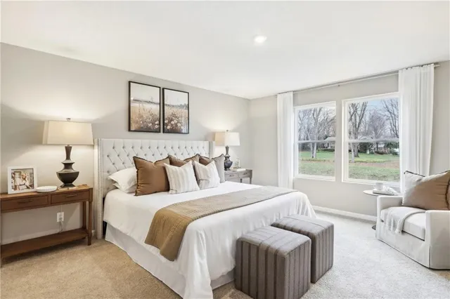 a bedroom with a bed and a couch