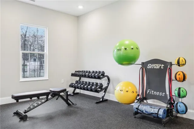a living room with a table and chairs