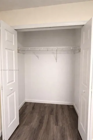 a view of an empty walk in closet