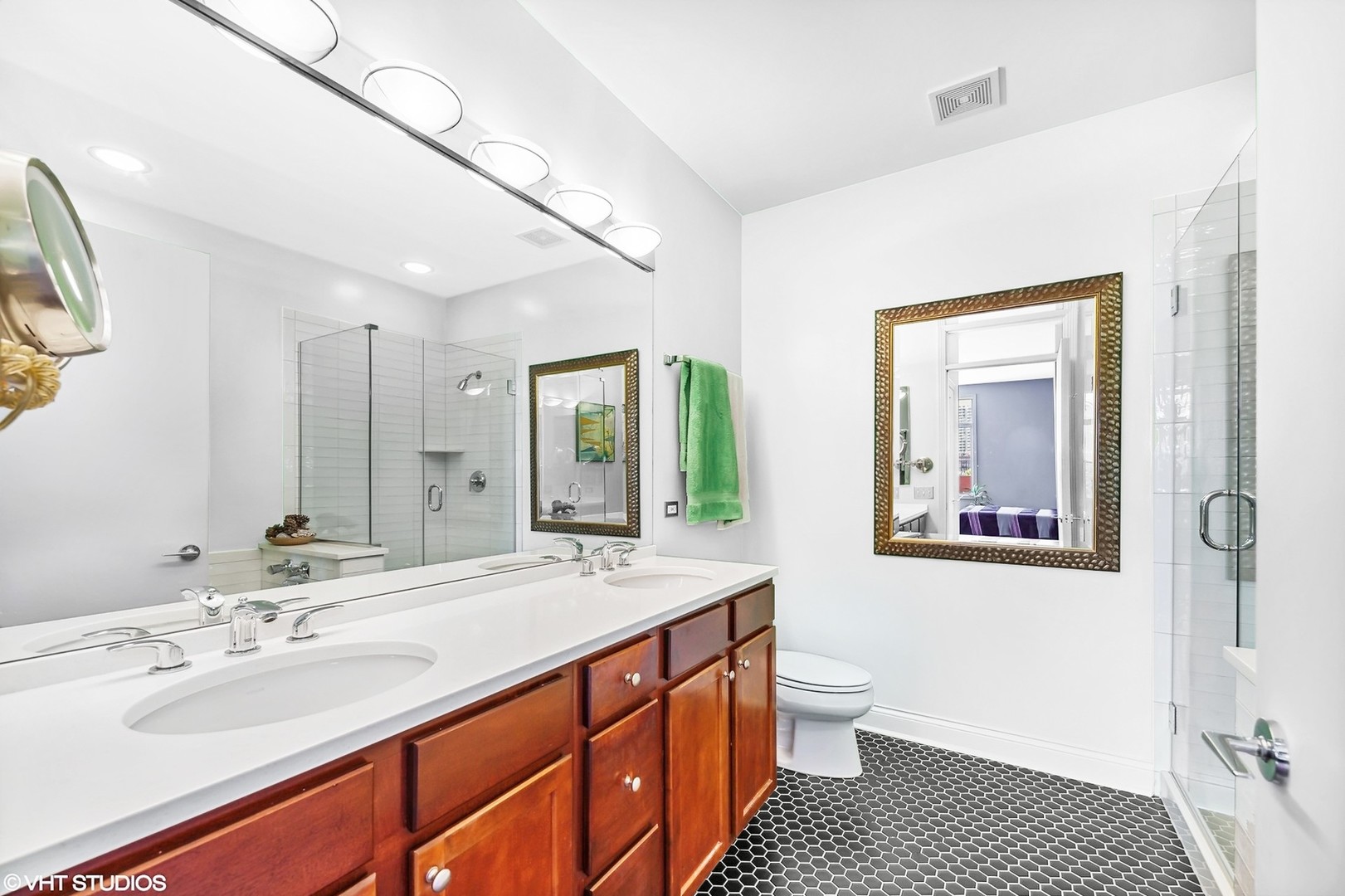 330 North Clinton Street, Unit 504 Chicago, IL 60661 - Photo 16 of 25 a bathroom with a sink a toilet and a mirror
