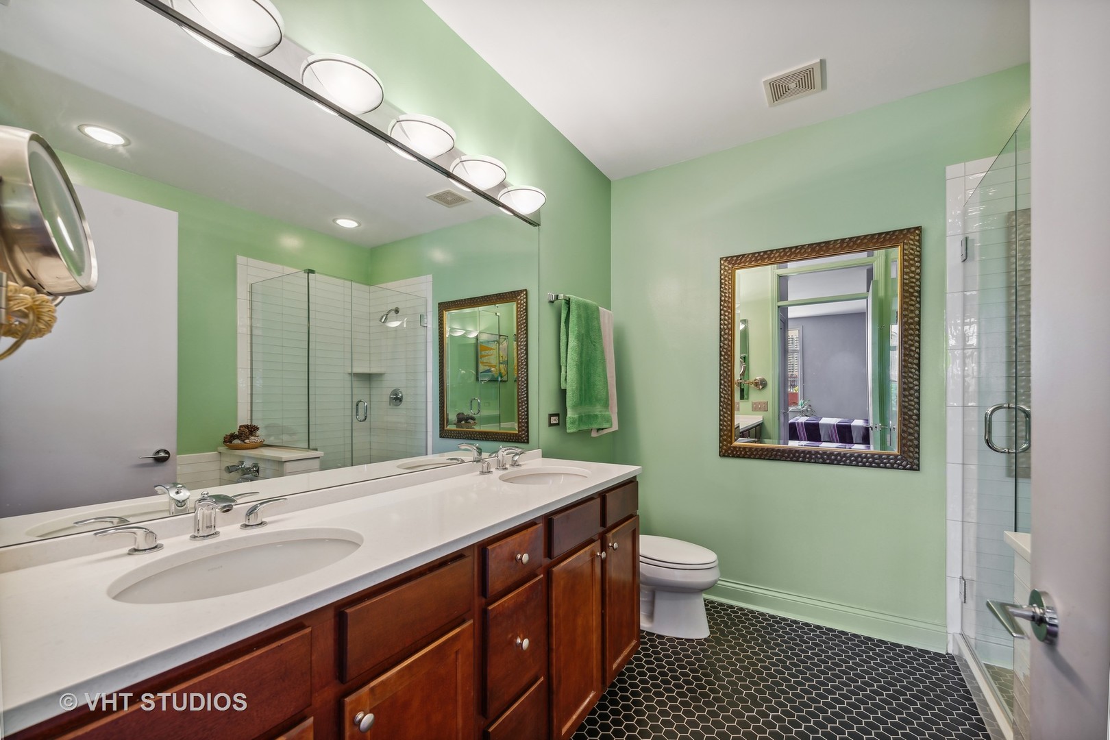 330 North Clinton Street, Unit 504 Chicago, IL 60661 - Photo 18 of 25 a bathroom with a sink a toilet and a mirror