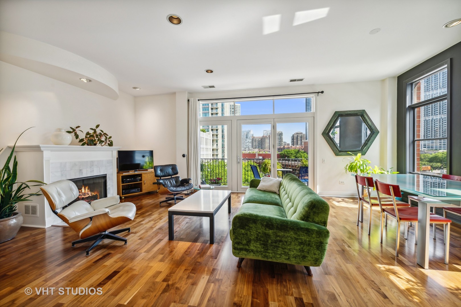 330 North Clinton Street, Unit 504 Chicago, IL 60661 - Photo 8 of 25 a living room with furniture and a fireplace