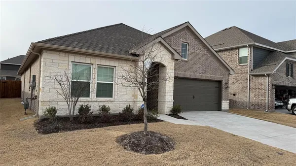 a front view of a house with a garage