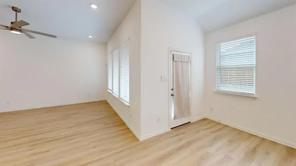 an empty room with windows