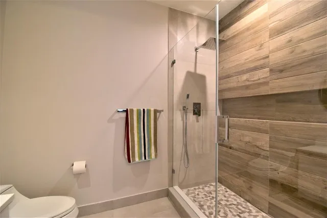 a kitchen with a refrigerator stove top oven and sink