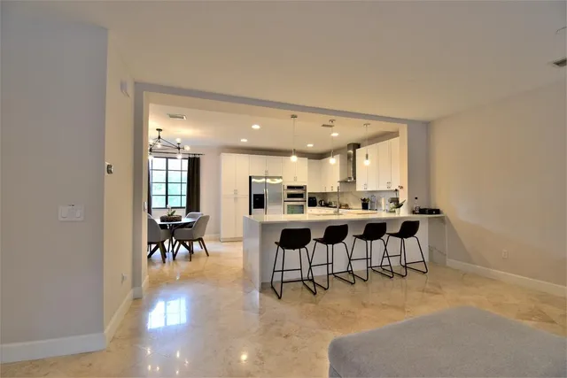 a dining room with furniture window and wooden floor
