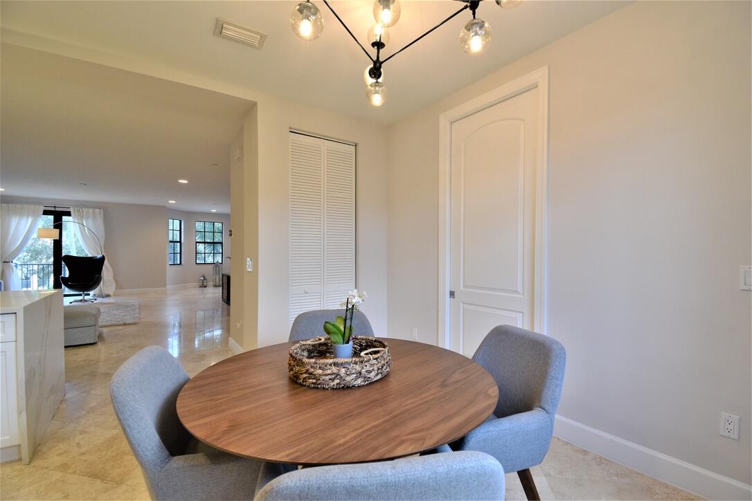 4866 Northwest 16th Avenue Boca Raton, FL 33431 - Photo 21 of 68 a view of a dining room with furniture