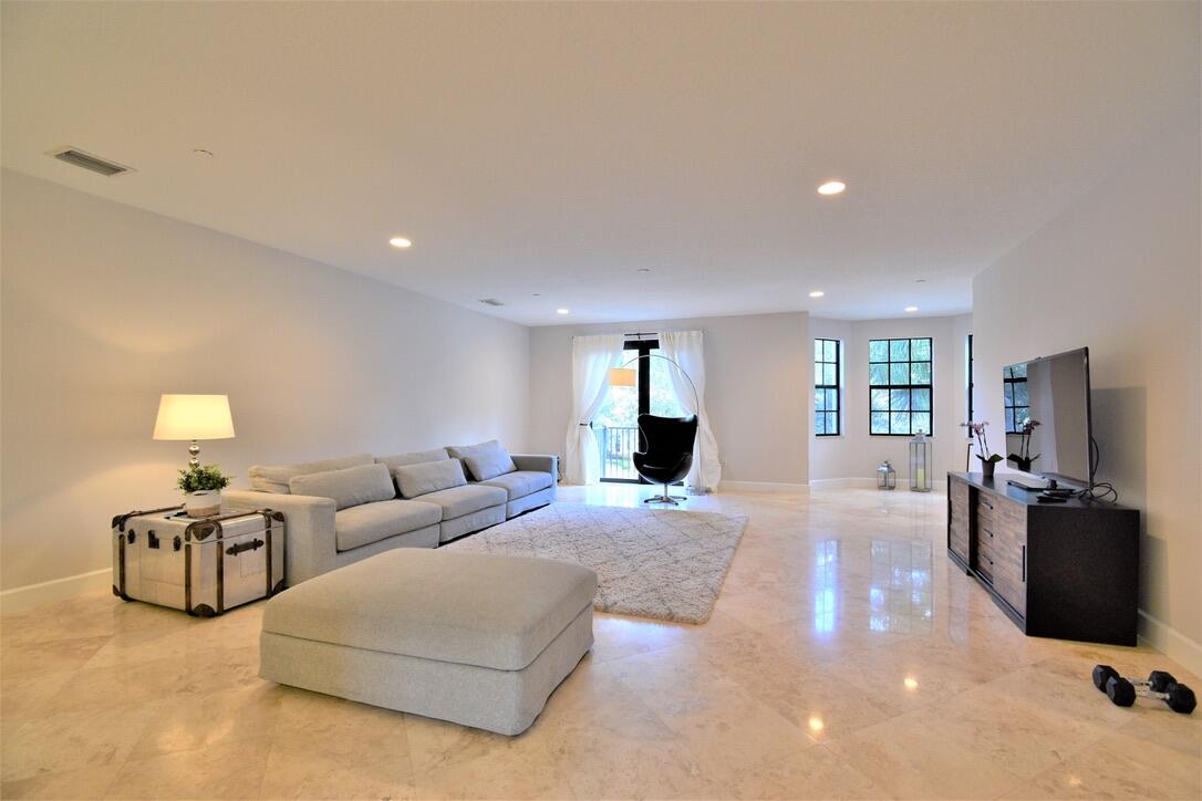 4866 Northwest 16th Avenue Boca Raton, FL 33431 - Photo 22 of 68 a living room with furniture window and lamp