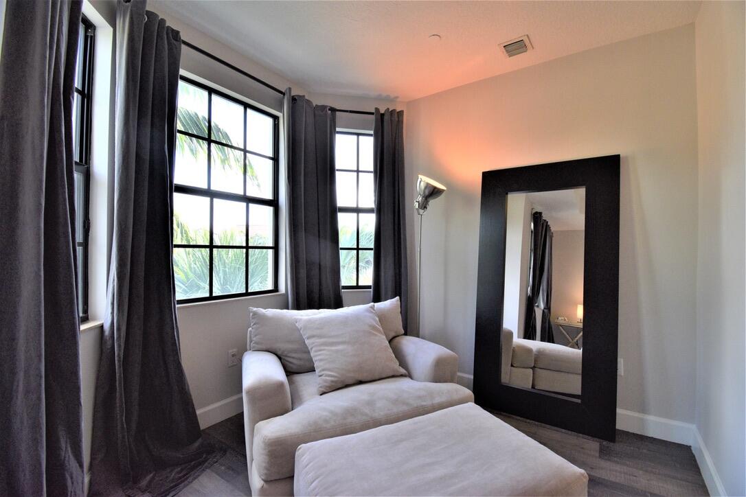 4866 Northwest 16th Avenue Boca Raton, FL 33431 - Photo 37 of 68 a living room with furniture and a window