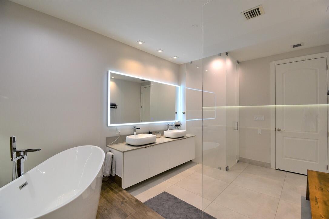 4866 Northwest 16th Avenue Boca Raton, FL 33431 - Photo 42 of 68 a bathroom with a sink and a mirror