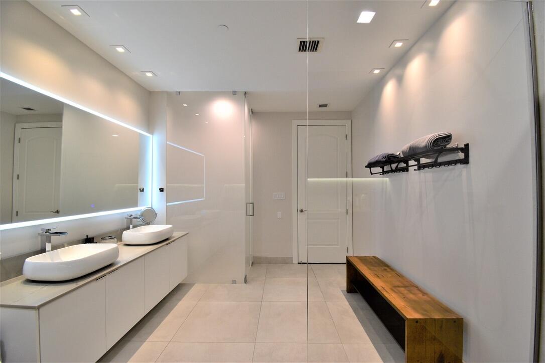 4866 Northwest 16th Avenue Boca Raton, FL 33431 - Photo 43 of 68 a living room with furniture and a chandelier