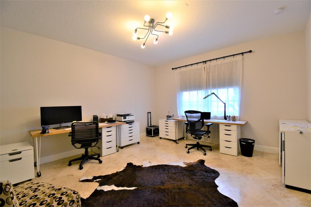 4866 Northwest 16th Avenue Boca Raton, FL 33431 - Photo 47 of 68 a view of a workspace with furniture and a window
