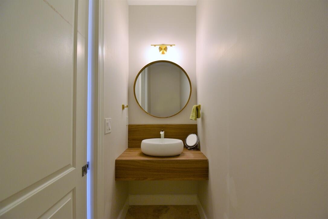 4866 Northwest 16th Avenue Boca Raton, FL 33431 - Photo 48 of 68 a bathroom with a sink and a mirror