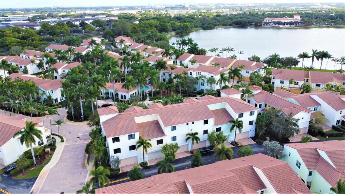 4866 Northwest 16th Avenue Boca Raton, FL 33431 - Photo 55 of 68 an aerial view of house with yard and lake view