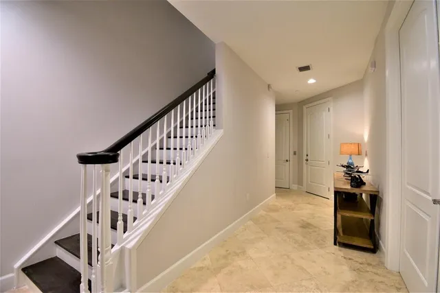 a view of a workspace with furniture and gym equipment