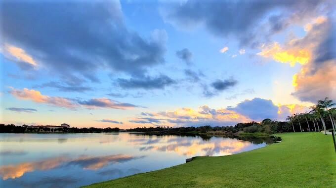 4866 Northwest 16th Avenue Boca Raton, FL 33431 - Photo 66 of 68 a view of a lake with houses in the back