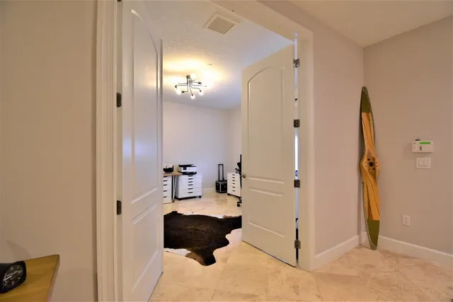 a bathroom with a toilet and a mirror