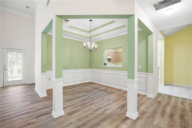 a view of front door and wooden floor