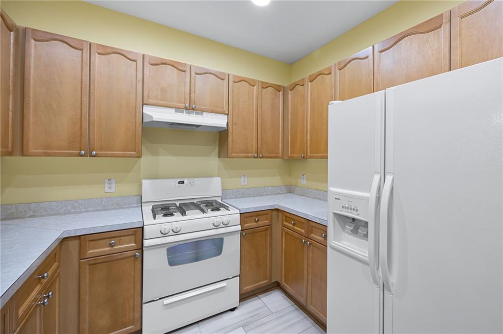 3832 Abbott Lane, Unit 1 Powder Springs, GA 30127 - Photo 19 of 37 a kitchen with a stove and a refrigerator