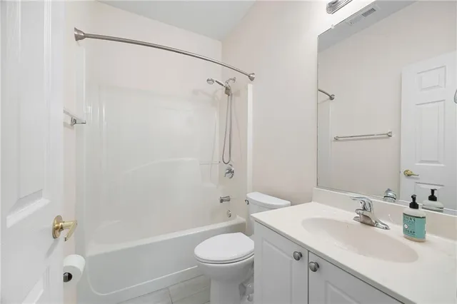 a bathroom with a sink toilet tub and shower