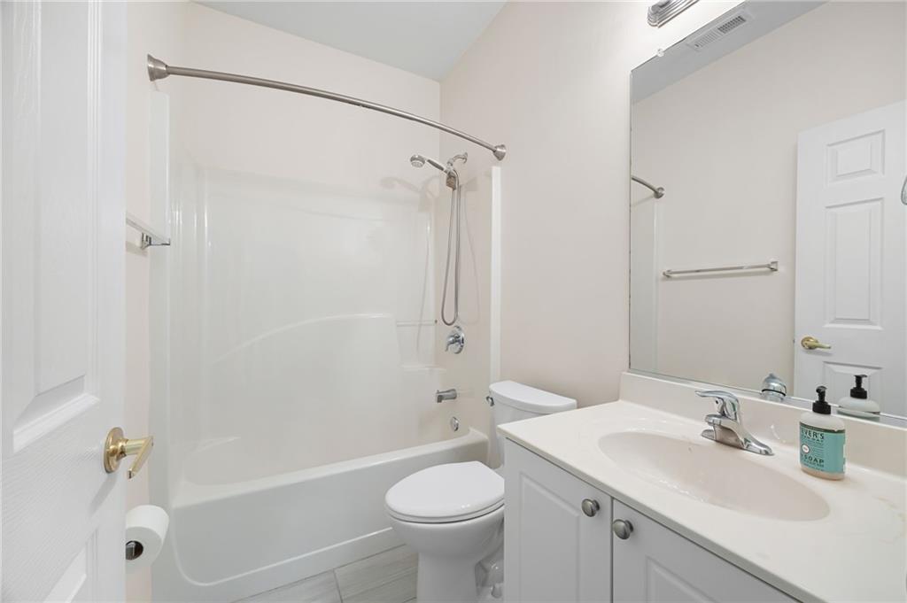3832 Abbott Lane, Unit 1 Powder Springs, GA 30127 - Photo 24 of 37 a bathroom with a sink toilet tub and shower