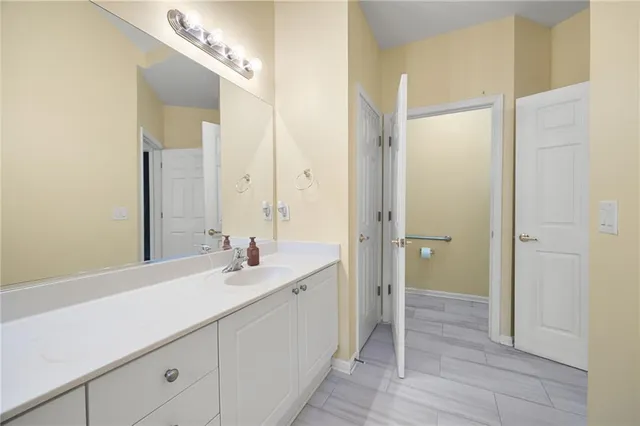 a bathroom with a sink and a mirror