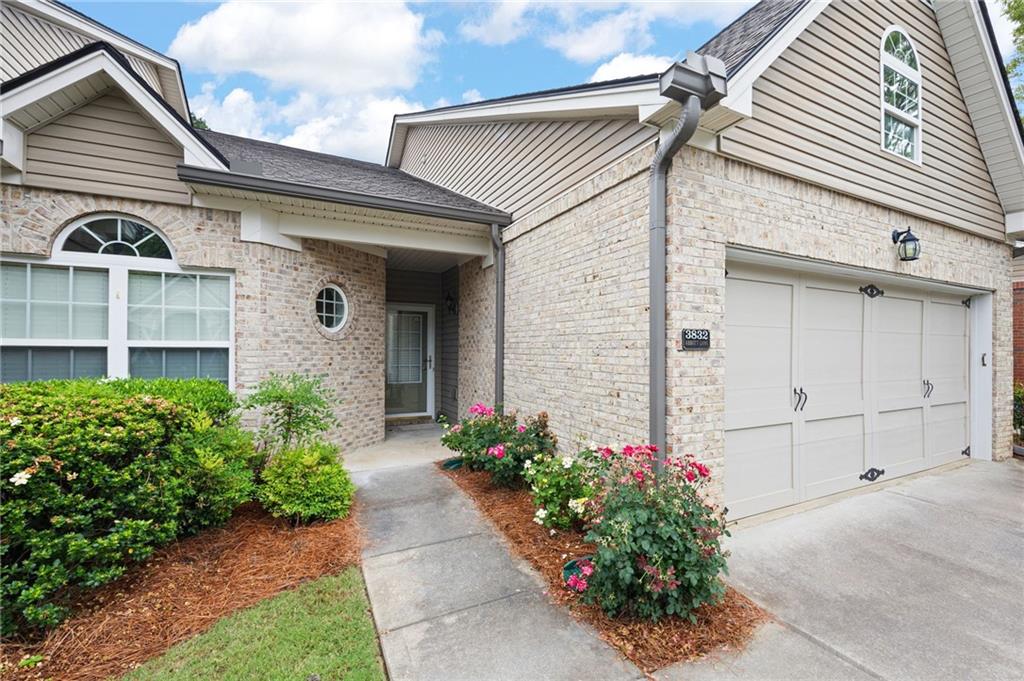3832 Abbott Lane, Unit 1 Powder Springs, GA 30127 - Photo 3 of 37 a front view of a house with a garden