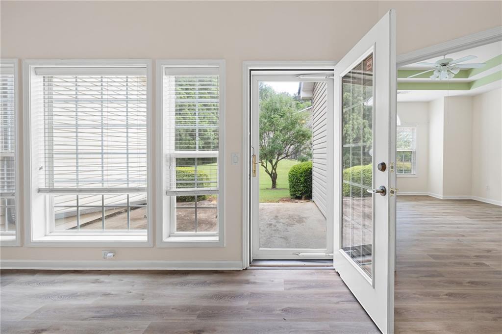 3832 Abbott Lane, Unit 1 Powder Springs, GA 30127 - Photo 31 of 37 a view of a hallway with wooden floor and windows