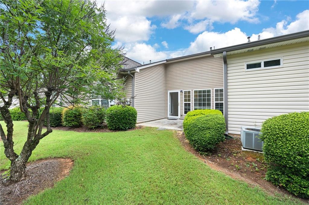 3832 Abbott Lane, Unit 1 Powder Springs, GA 30127 - Photo 34 of 37 a view of a house with a backyard
