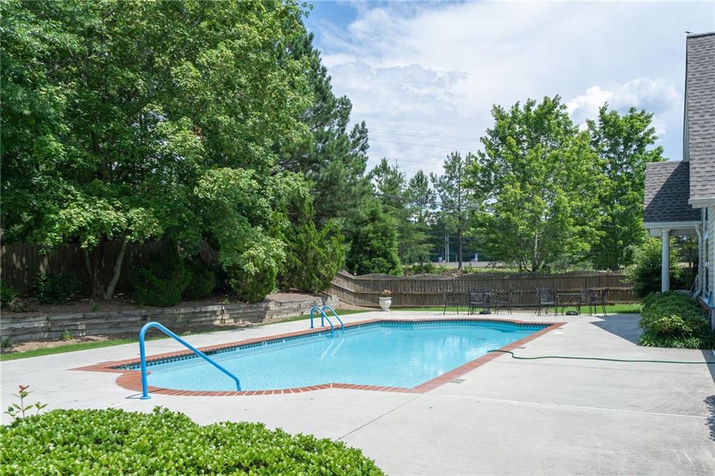 3832 Abbott Lane, Unit 1 Powder Springs, GA 30127 - Photo 35 of 37 a view of a swimming pool with a yard