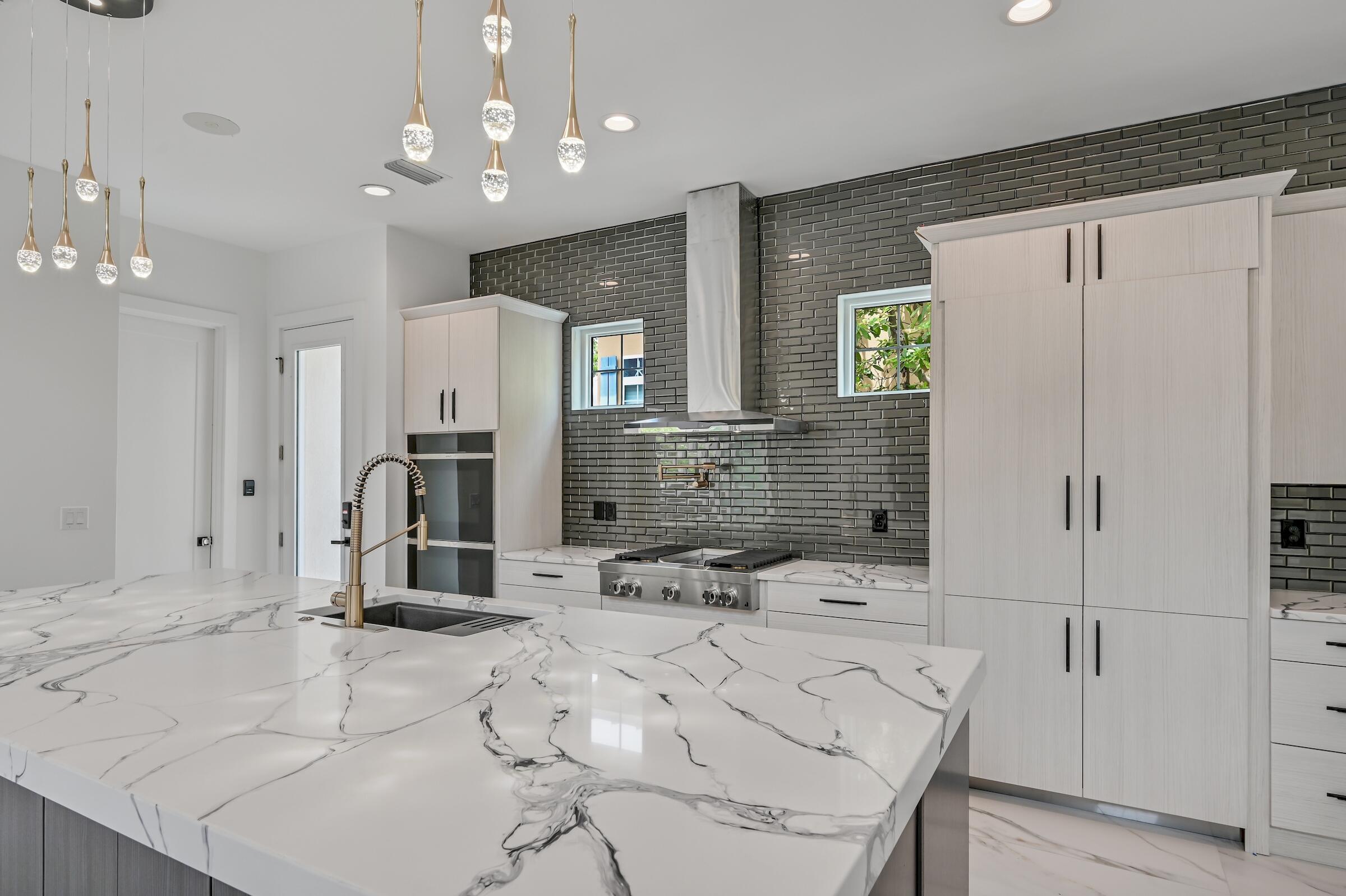 80 Rue Martine Miramar Beach, FL 32550 - Photo 14 of 54 a bathroom with a sink a large mirror and shower