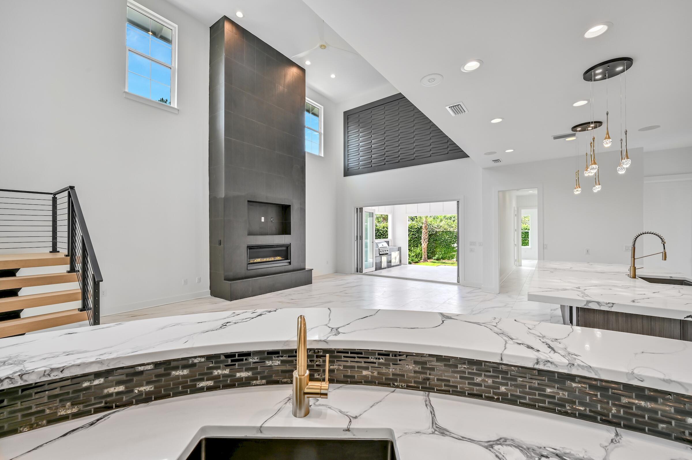 80 Rue Martine Miramar Beach, FL 32550 - Photo 18 of 54 a kitchen with stainless steel appliances granite countertop a sink and a stove
